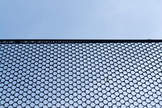 Rabitz wire netting with blue sky at background