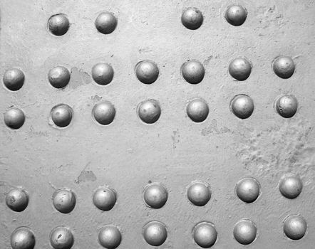 Industrial steel plate with grey round rivets