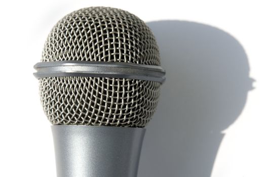 Grey microphone on a white background