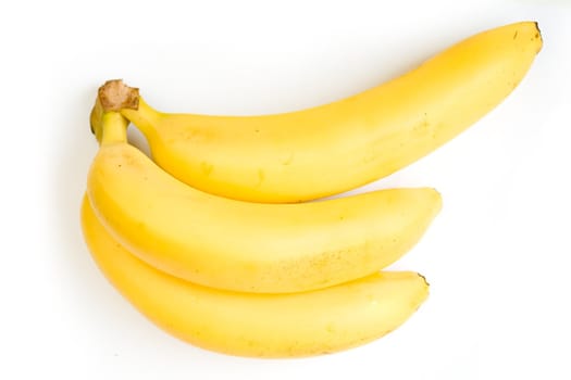 three ripe bananas on a white background
