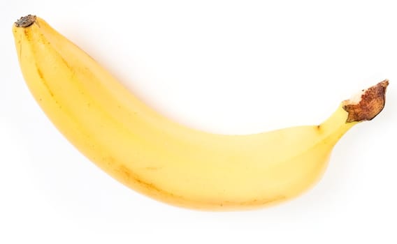 one ripe banana on a white background