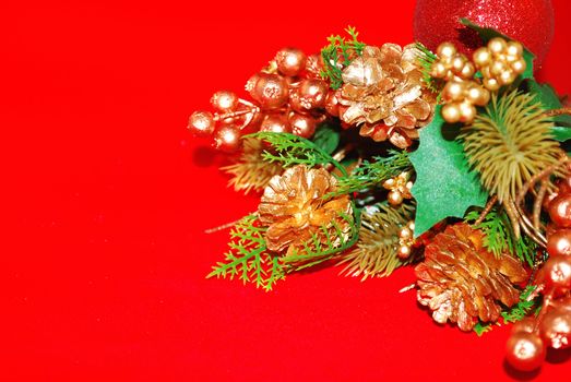 Christmas gold floral decor isolated on the red. 