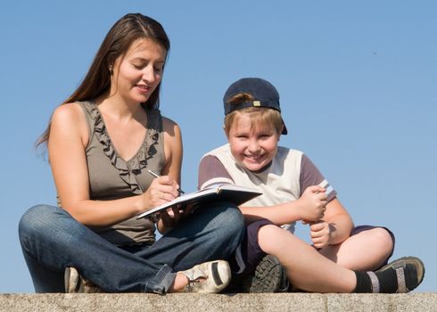 Family with book on a sky background