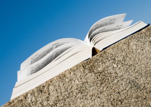 Holy Bible. The open book with sky at background