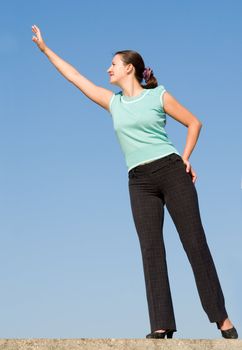 beautiful girl stretches the hand upwards