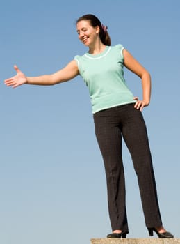 beautiful woman greeting on a blue sky