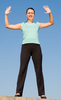 beautiful woman greeting on a blue sky