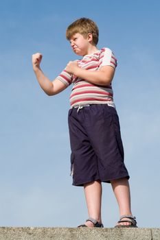 fighter boy with blue sky at background