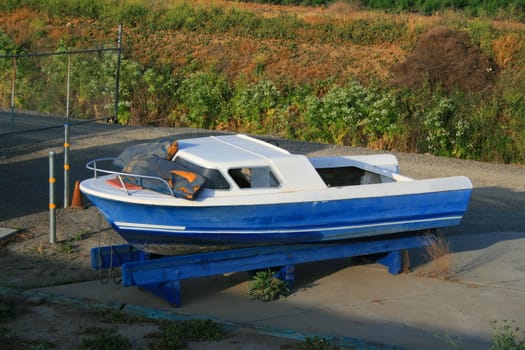 Old boat at a boat storage place.
