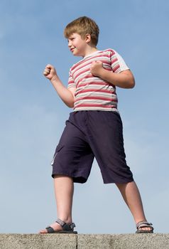 fighter boy with blue sky at background