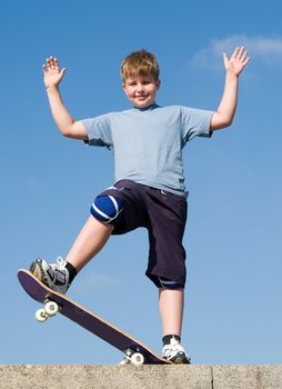 boy with skateboard on a blue sky