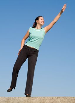beautiful girl stretches the hand upwards