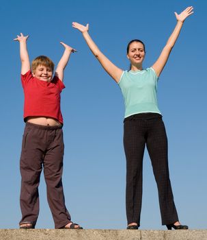 Cheerful family with blue sky at background