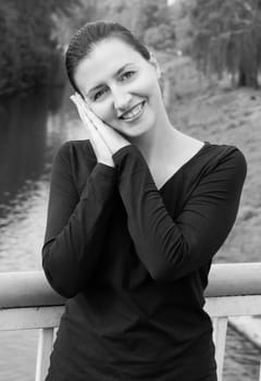 portrait of a beautiful woman with river at background