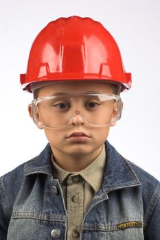 Portrait of a boy in a red protective helmet