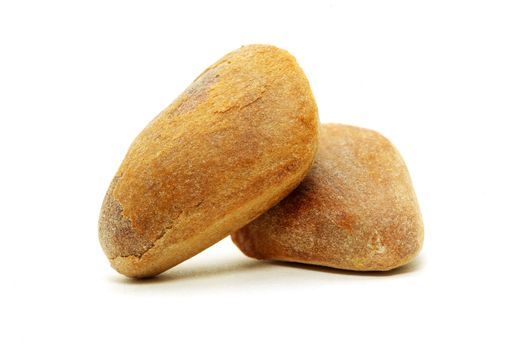 Brown cedar nuts fruit on white background