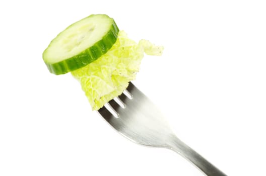 fresh cucumber on a fork