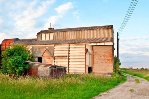 Nice vibrant image of a farm buildng in summer time