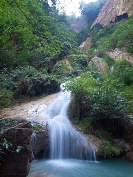 Emerald color water in tier seventh of Erawan waterfall, Erawan National Park, Kanchanaburi, Thailand