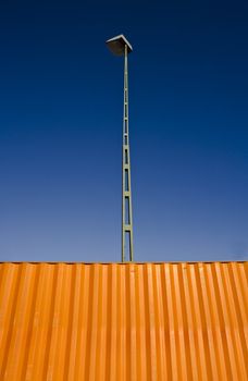 Orange Cargo Container towards blue sky