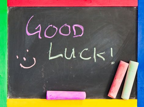 Good luck written in chalk on a black board