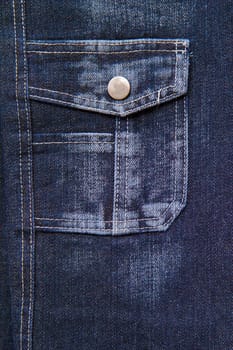 blue denim with a pocket. Abstract background