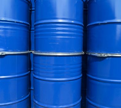 Blue oil drums full frame