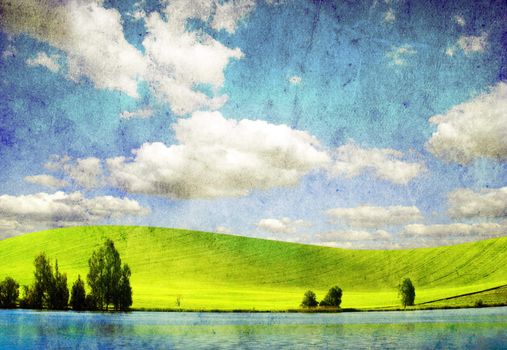 grunge image of green field and blue sky