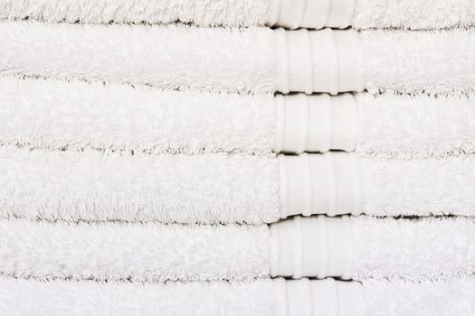 Stack of clean white towels as a background