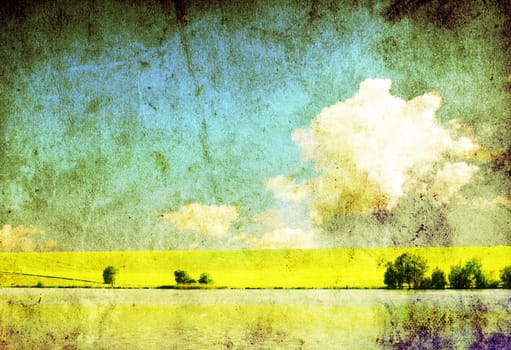 grunge image of green field and blue sky