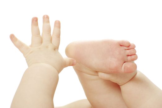 newborn baby feet and hands isolated on white