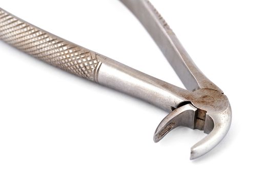 old dental pliers on a white background