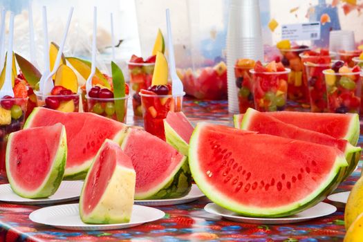 Fresh melons sliced and for sale at a stall