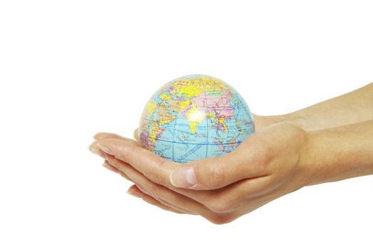 Hand holdings a globe on a white