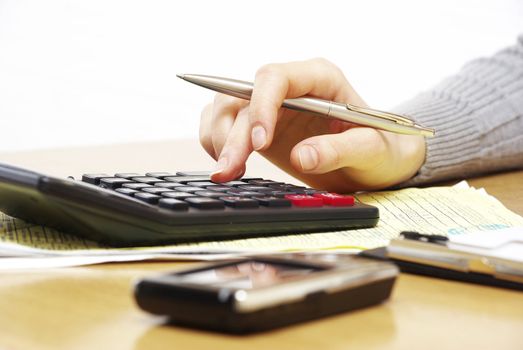Business concept with pen and calculator