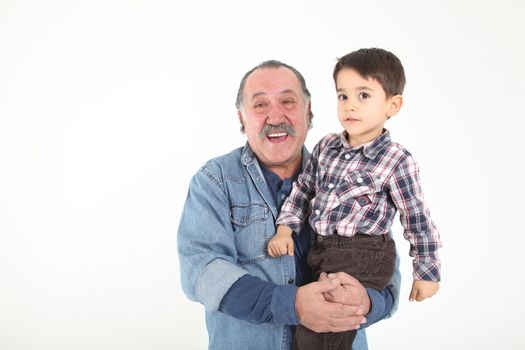 Child and grandfather stay together on white background