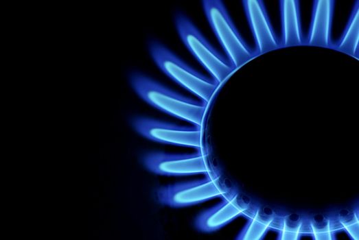 flames of gas stove in the dark