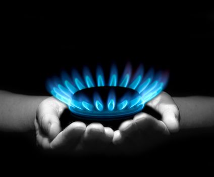 Hands holding a flame gas