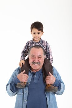 Child and grandfather stay together on white background