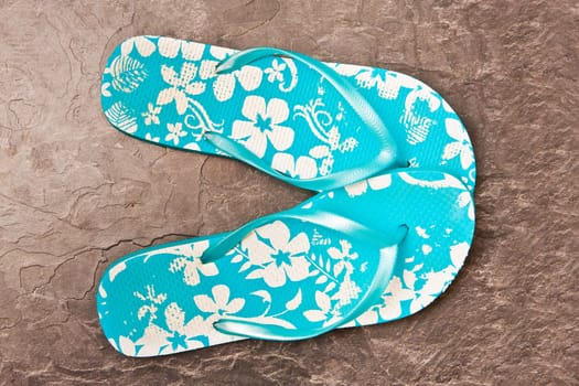 A pair of bright blue summer sandals