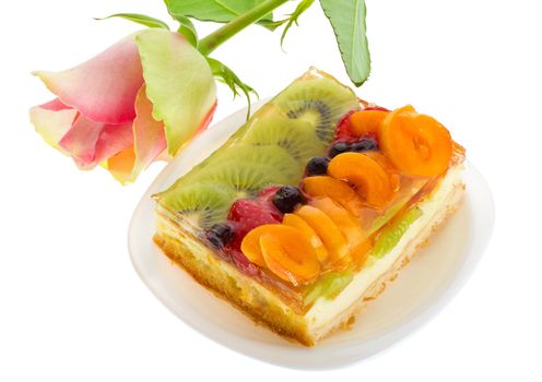 close-up curd cake with fruits and rose, isolated on white