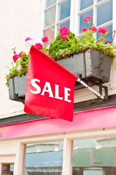 Sale sign on a small boutique shop in England