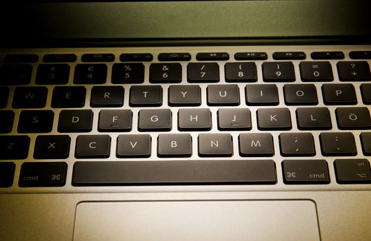 Laptop keyboard squared black buttons on white background