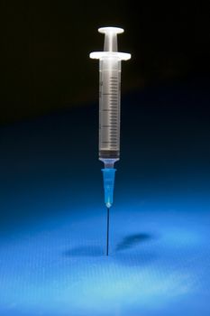 Ready and isolated medical syringe standing head down