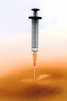 Shaded and ready medical syringe standing head down