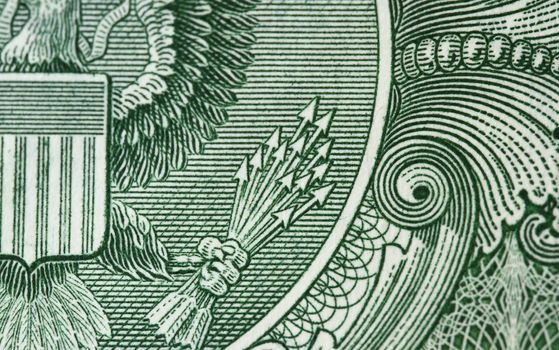 Detail of one dollar bill - with the 13 arrow as the focus subject.