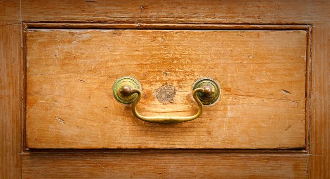 An antique wooden drawer