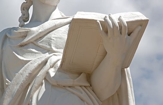 woman reading:  17th statue representing a woman who reads