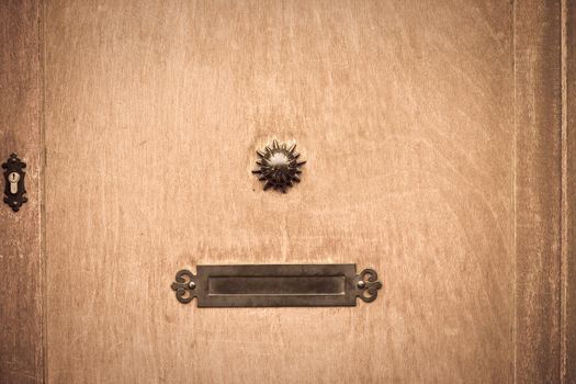 Old fashioned letterbox in a wooden door