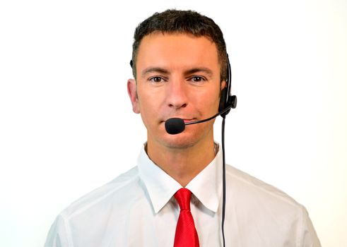 Good looking young man with headset isolated on white background